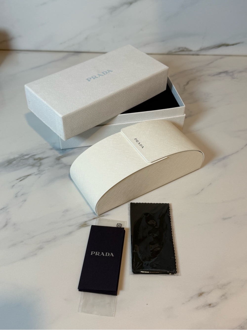 Prada sunglasses case with original packaging